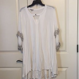 Jodifl high-low tunic with fringe sleeves.